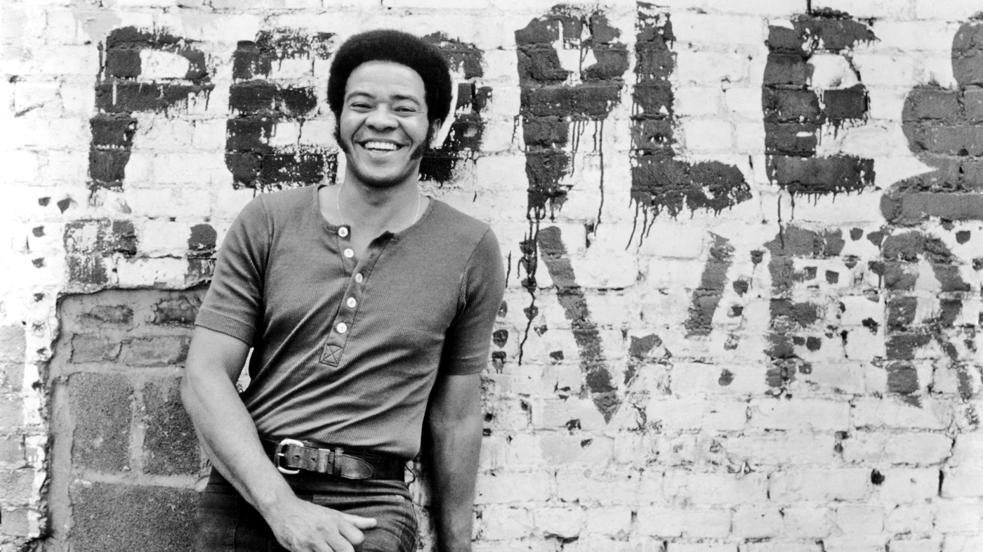 Bill Withers posing for a portrait around 1973.